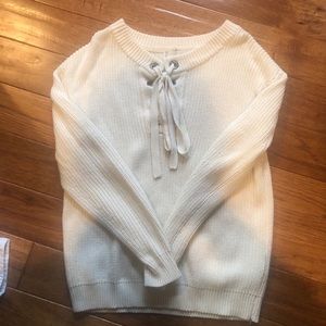 Cream sweater with lace-up front